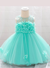 Load image into Gallery viewer, The dress has a bodice with flower applique and tulle skirt