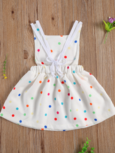 Load image into Gallery viewer, Baby white dress has a colorful polka dot print and rainbow applique pullover style ties at the back
