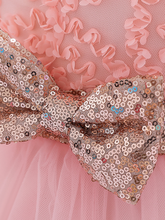 Load image into Gallery viewer, Baby dress has a floral bodice, a tulle skirt with floral hem, and a gold sequin belt with bow at the front and back