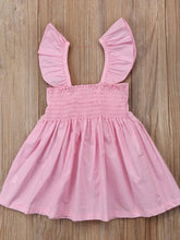 Load image into Gallery viewer, Baby apron style dress has a ruffled adjustable straps and a stretchy bodice with a big bow