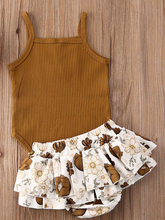Load image into Gallery viewer, Baby onesie bodysuit has a cute ruffle detail and front buttons and spaghetti straps and skirted bloomers