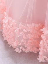Load image into Gallery viewer, Baby dress has a floral bodice, a tulle skirt with floral hem, and a gold sequin belt with bow at the front and back