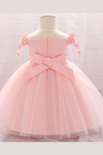 Load image into Gallery viewer, Baby dress has a satin embroidered bodice with pearl details and capped sleeves, a bow belt at the waist, and a tulle skirt with flower applique