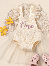 Load image into Gallery viewer, Baby lace overall onesie that ties at the back with tulle train, little ruffles at the shoulder, and a gold "One" printed on the bodice
