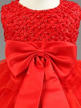 Load image into Gallery viewer, Baby tulle dress bodice has a delicate pearl detail with a bow at the waistline and a multilayer tulle skirt