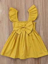 Load image into Gallery viewer, Baby apron style dress has a ruffled adjustable straps and a stretchy bodice with a big bow