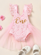 Load image into Gallery viewer, Baby lace overall onesie that ties at the back with tulle train, little ruffles at the shoulder, and a gold "One" printed on the bodice