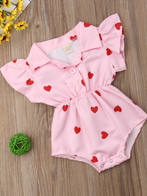 Load image into Gallery viewer, Baby onesie with ruffled short sleeves and a cute collar. Front button and elastic waist. Pink with red hearts