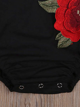 Load image into Gallery viewer, Baby little onesie has big red flower appliques and ties at the back for easy slip-on black
