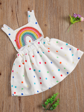 Load image into Gallery viewer, Baby white dress has a colorful polka dot print and rainbow applique pullover style ties at the back
