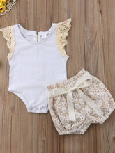 Load image into Gallery viewer, Baby set features a short-sleeved onesie with a crochet ruffle at the shoulder and embroidered shorts with a sash
