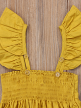 Load image into Gallery viewer, Baby apron style dress has a ruffled adjustable straps and a stretchy bodice with a big bow

