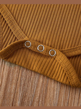 Load image into Gallery viewer, Baby onesie bodysuit has a cute ruffle detail and front buttons and spaghetti straps and skirted bloomers
