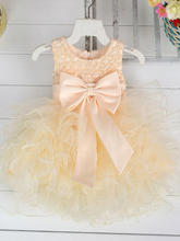 Load image into Gallery viewer, Baby princess dress has a satin bodice with pearl details, a bow belt at the waist, and a layered tulle skirt -creme
