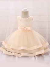 Load image into Gallery viewer, Baby dress features beautiful beads on the bodice, voile with satin hem-creme
