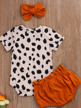 Load image into Gallery viewer, Baby set features a short-sleeved onesie with animal print, bloomer shorts with a bow, and matching headbands

