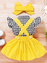 Load image into Gallery viewer, Baby set features a plaid top with front buttons and bow at the color, a skirt with cute suspenders, and a matching headband
