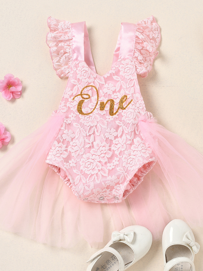 Baby lace overall onesie that ties at the back with tulle train, little ruffles at the shoulder, and a gold 
