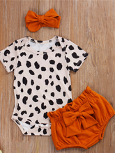 Load image into Gallery viewer, Baby set features a short-sleeved onesie with animal print, bloomer shorts with a bow, and matching headbands
