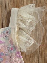 Load image into Gallery viewer, Baby overall style onesie with delicate flower embroidered, lace ruffles on the bum that ties in the back, tulle, and lace ruffled shoulders
